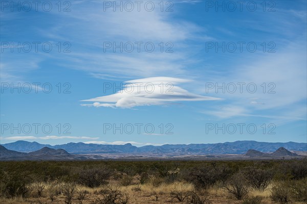 Lenticular cloud over landscape