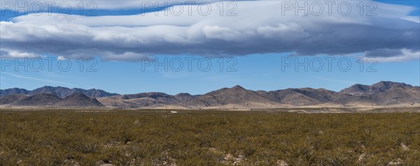 Clouds over desert landscape in Gila National Forest