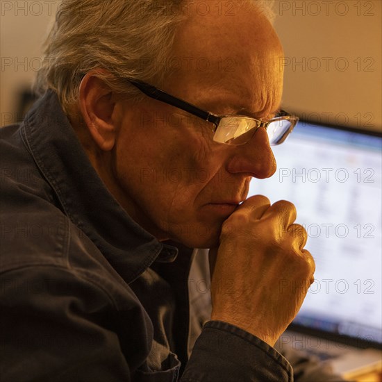 Senior man working at desk