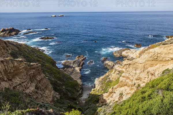 Ocean waves crashing against Big Sur coast