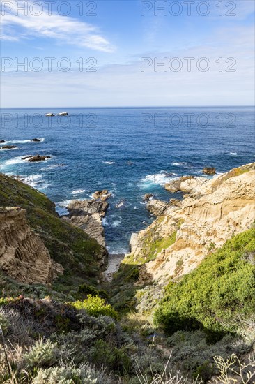 Ocean waves crashing against Big Sur coast