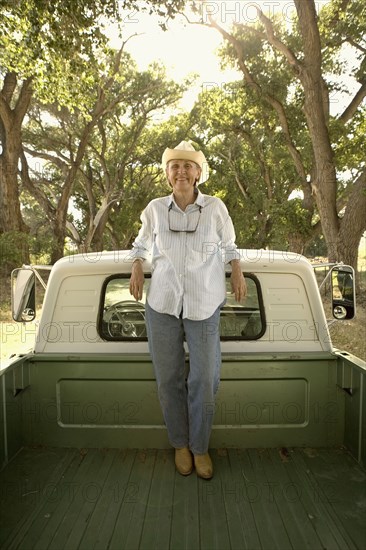 Senior woman on pick-up truck