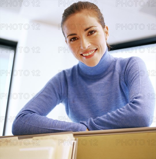 Portrait of young woman in office