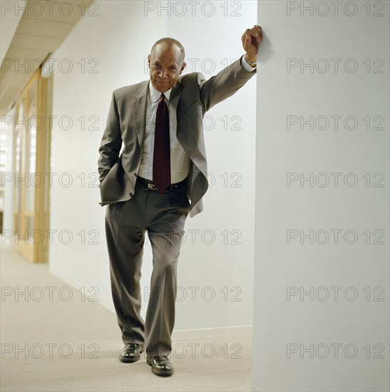 Businessman in office hallway