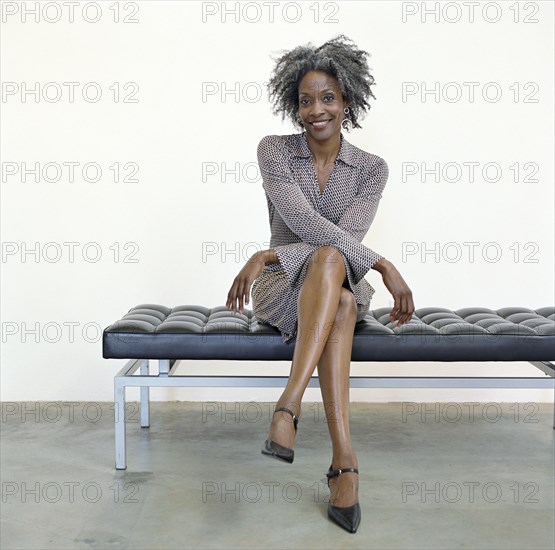 Portrait of woman sitting on bench