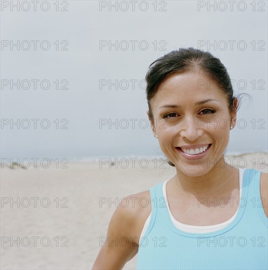 Portrait of smiling woman on beach