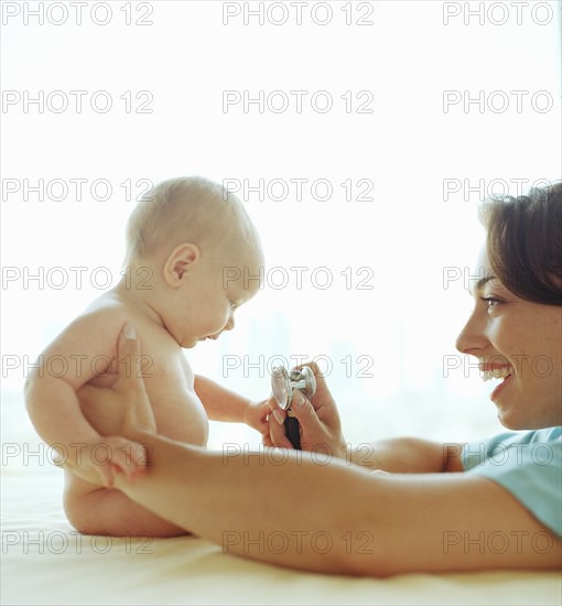 Doctor examining baby girl