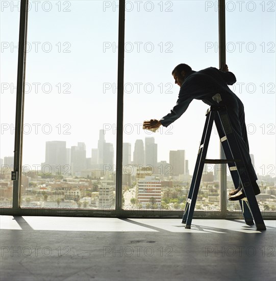 USA, California, Los Angeles, Window washer cleaning windows