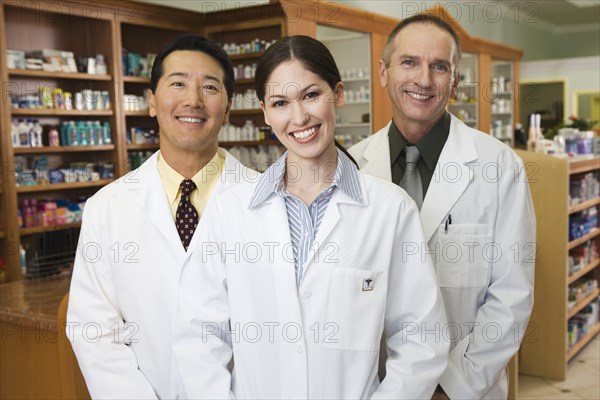 Portrait of three pharmacists in pharmacy