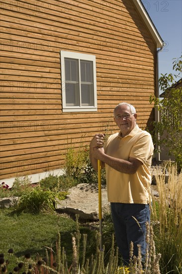 Portrait of senior man in garden