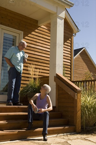 Couple on home front steps