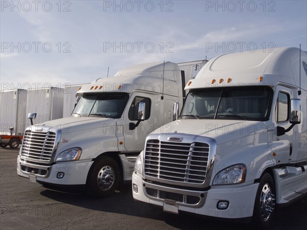 Semi trucks in parking lot