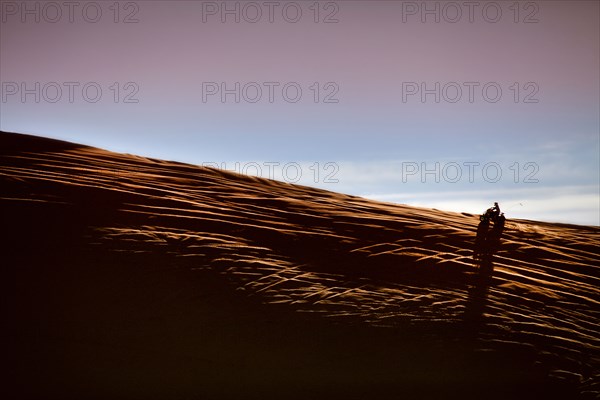 Person riding ATV in desert