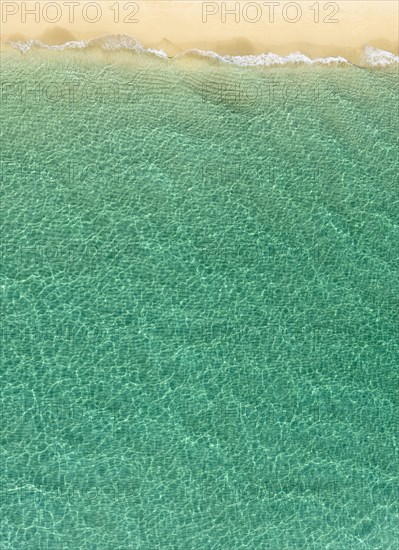 Overhead view of turquoise ocean and beach