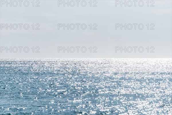 Calm sea surface reflecting sunlight