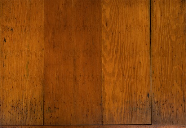 Close-up of worn antique cutting board with knife cut marks