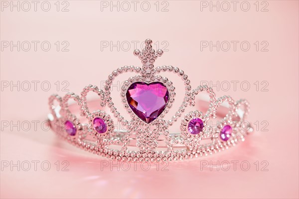 Studio shot of tiara with artificial pink gemstones