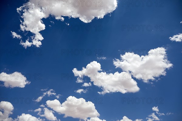 White puffy clouds on blue sky