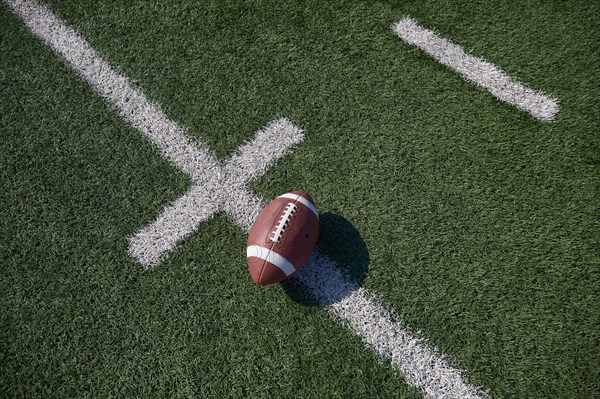 Overhead view of American football ball on field