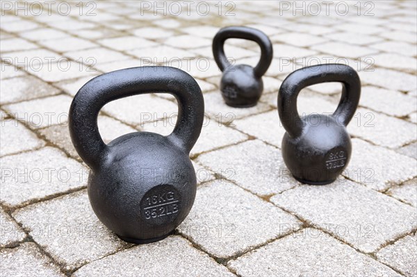 Kettlebells on sidewalk