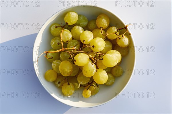 Overhead view of white grapes in bowl