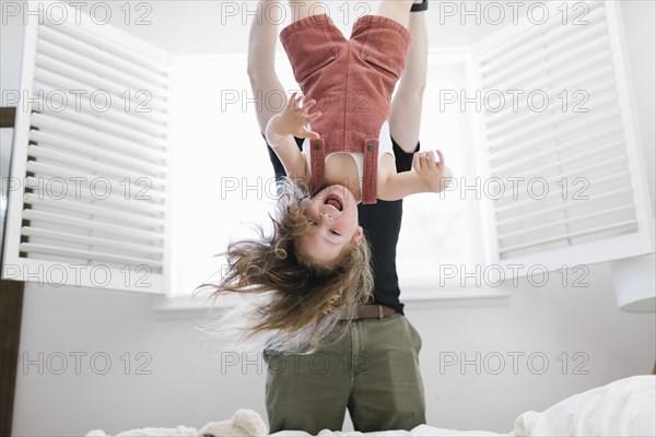 Father swinging daughter