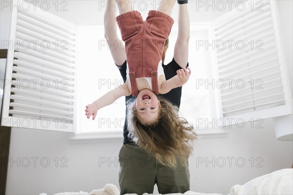 Father swinging daughter
