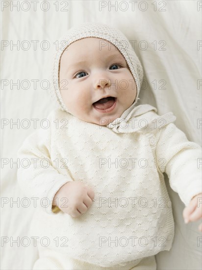 Overhead view of smiling baby boy