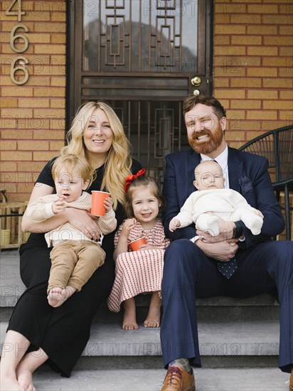 Portrait of parents with three children