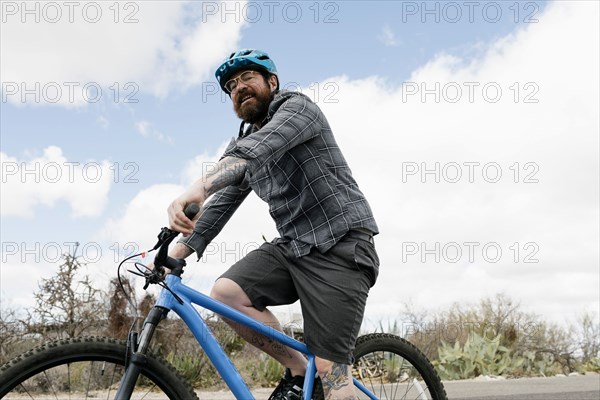 Man riding bike in desert