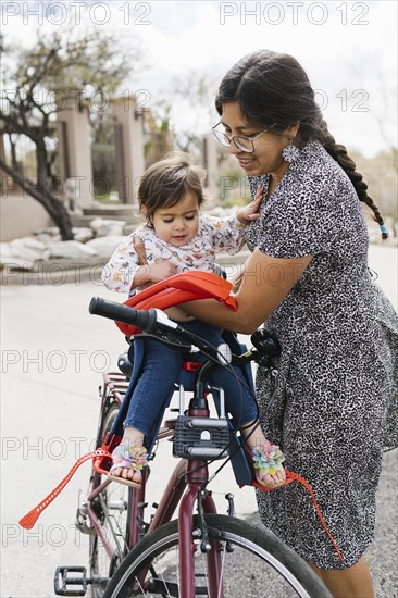 Mother placing daughter