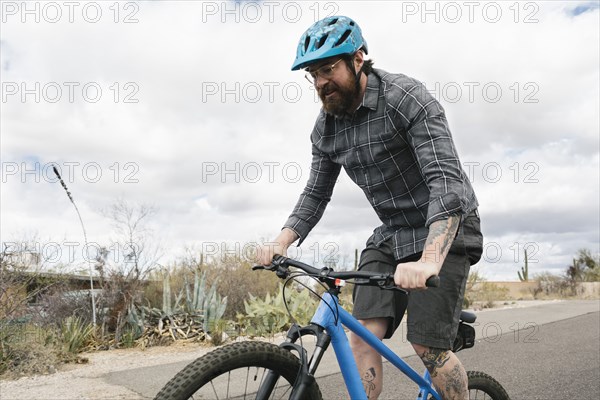 Man riding bike in desert