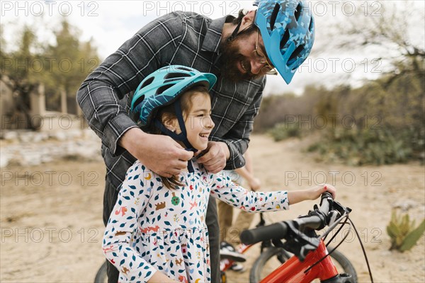 Father adjusting daughters