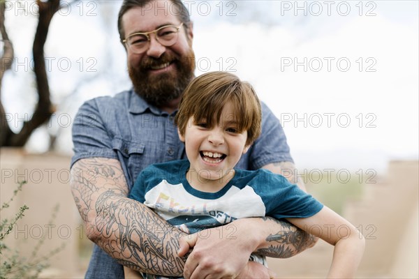 Father hugging son