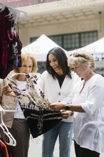 Women shopping at street market