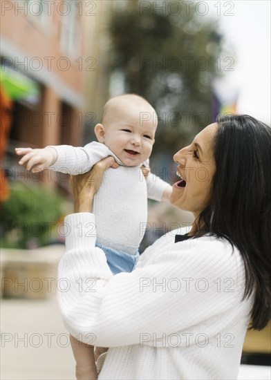 Grandmother holding baby grandson