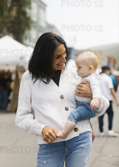 Grandmother holding baby grandson