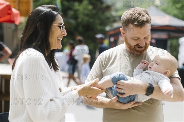 Smiling woman with son and grandson