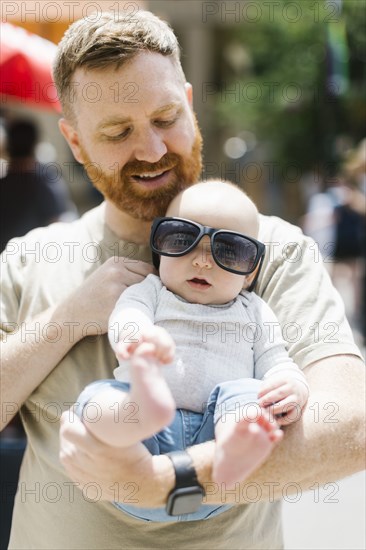 Father holding baby son