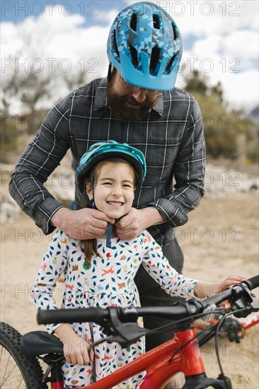 Father adjusting daughters