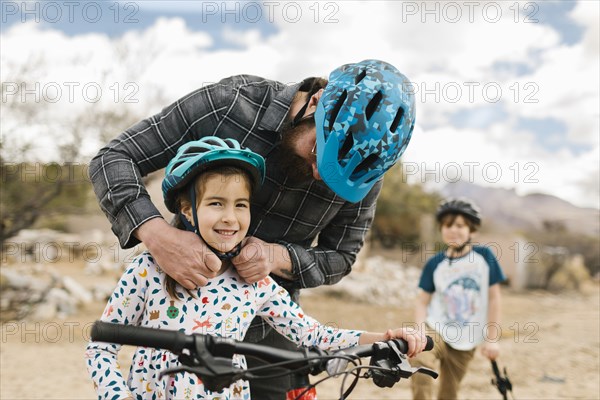 Father adjusting daughters