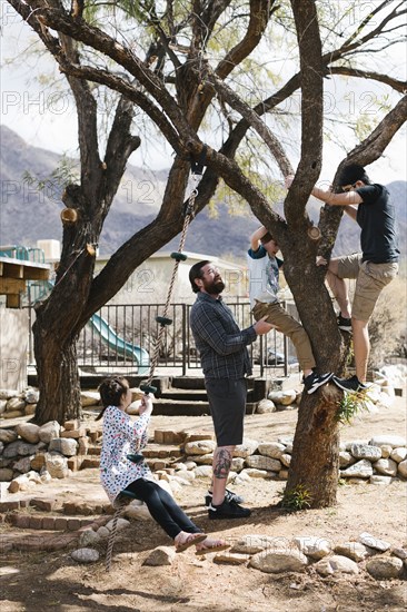 Father playing with children