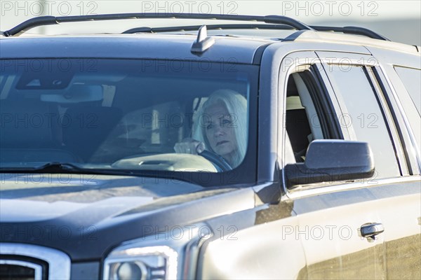 Senior woman driving SUV