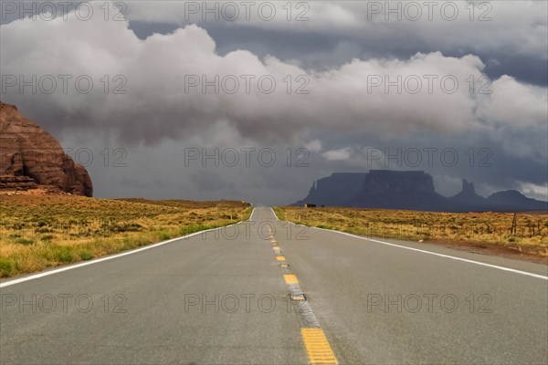 Storm clouds above desert road