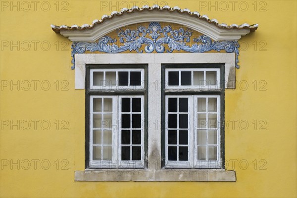 Yellow building with traditional tile work