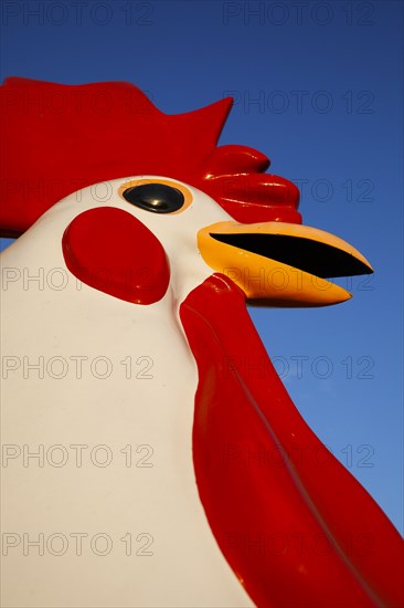 Large red rooster statue