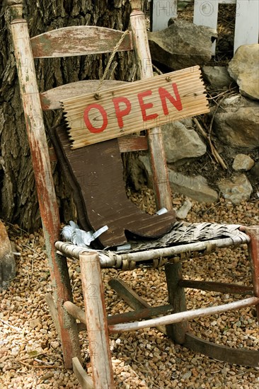 Rustic chair with sign