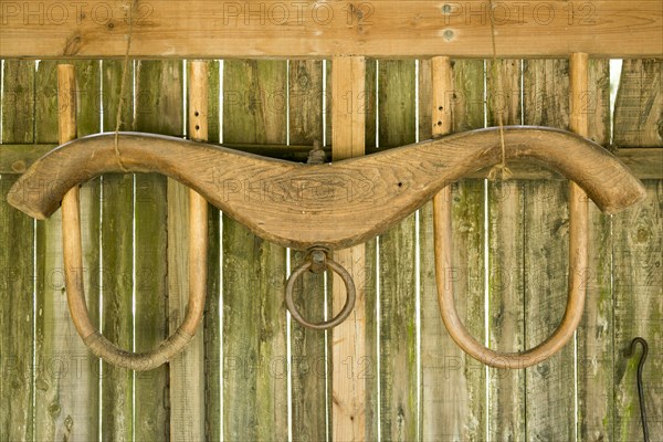 Yoke hanging on wooden barn