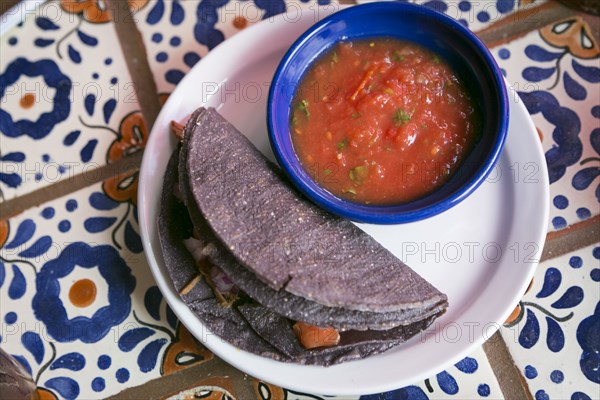 Taco with salsa on plate