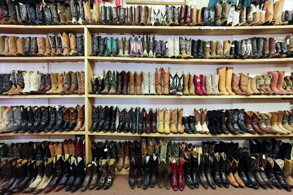 Vintage cowboy boots on shelves